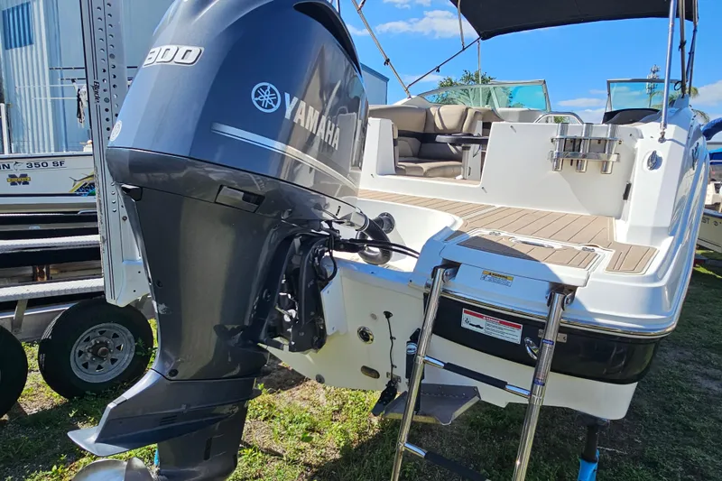 Slide: The Image of 2016 Hurricane SunDeck 2690 OB boat with Yamaha 300 outboard motor, docked outdoors. - 15