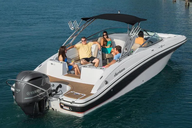 Slide: The Image of Manufacturer Provided Image: 2016 Hurricane SunDeck 2690 OB boat with passengers enjoying a sunny day on the water. - 2