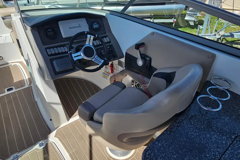 Slide: The Image of 2016 Hurricane SunDeck 2690 OB boat cockpit with Garmin navigation and comfortable seating. - 24