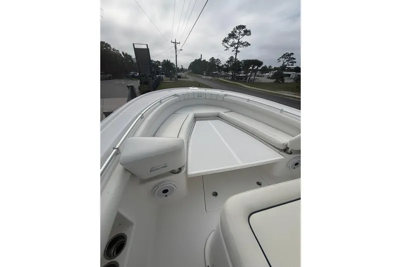 Slide: The Image of 2017 Buddy Davis 28 Center Console boat interior with seating and table. - 17