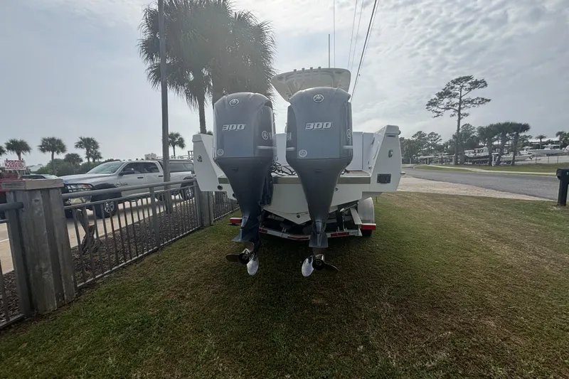 Slide: The Image of 2017 Buddy Davis 28 Center Console boat with twin Yamaha 300 engines on a trailer. - 5