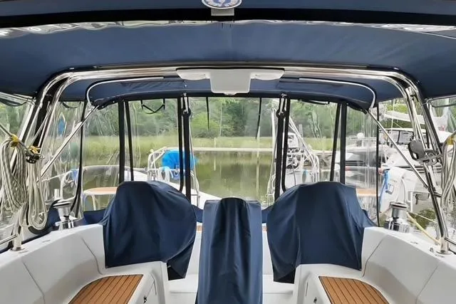 Slide: The Image of Interior view of a 2011 Hunter Aft Cockpit 50 sailboat with covered seating. - 10