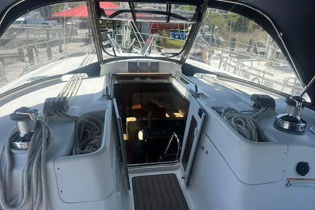 Slide: The Image of Cockpit view of 2011 Hunter Aft Cockpit 50 sailboat with ropes and open hatch. - 11