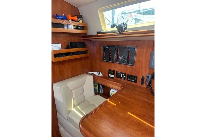 Slide: The Image of Interior of 2011 Hunter Aft Cockpit 50 yacht with navigation station and control panels. - 14
