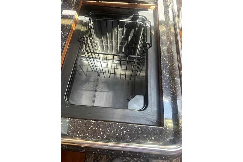 Slide: The Image of Built-in cooler on 2011 Hunter Aft Cockpit 50 yacht with speckled countertop. - 19