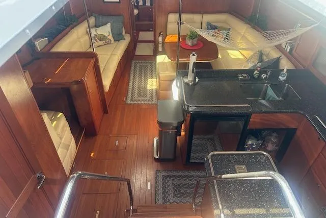 Slide: The Image of Luxurious 2011 Hunter Aft Cockpit 50 yacht interior with wood finish and modern amenities. - 21