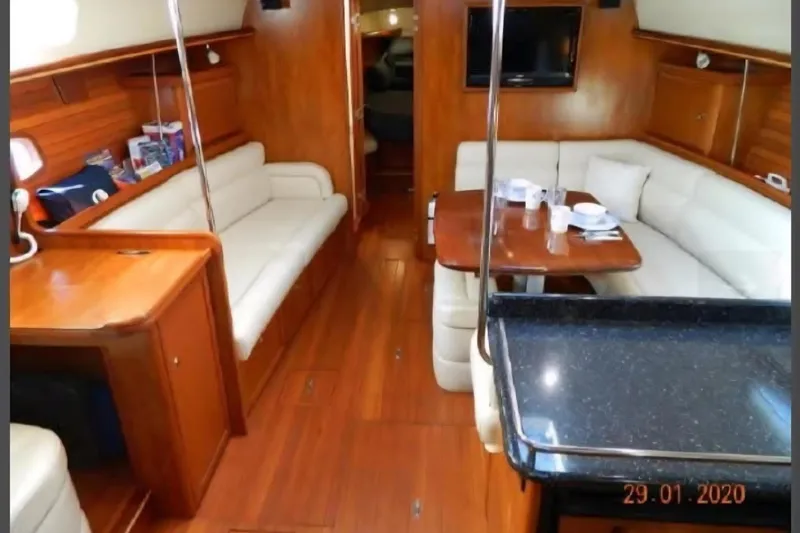 Slide: The Image of Luxurious interior of 2011 Hunter Aft Cockpit 50 yacht with elegant wood finish. - 22