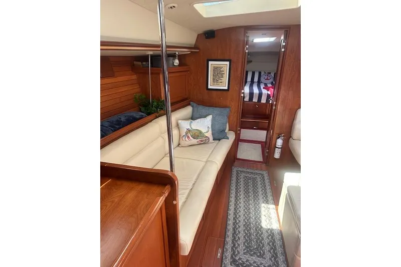 Slide: The Image of Interior of 2011 Hunter Aft Cockpit 50 yacht with cozy seating and nautical decor. - 24