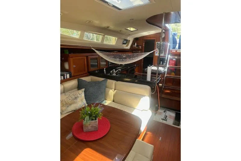 Slide: The Image of Luxurious interior of 2011 Hunter Aft Cockpit 50 yacht with elegant seating and decor. - 25