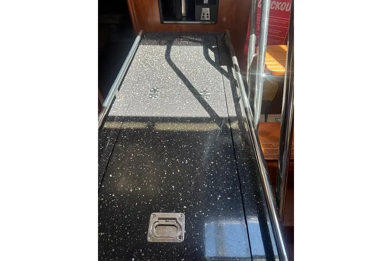 Slide: The Image of Engine of a 2011 Hunter 50 Aft Cockpit sailboat, showcasing mechanical components. - 30