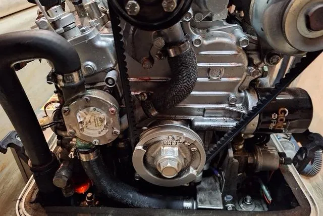 Slide: The Image of Engine compartment of a 2011 Hunter 50 Aft Cockpit sailboat, showcasing mechanical components. - 31