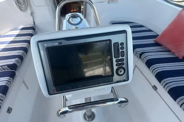 Slide: The Image of Cockpit of 2011 Hunter Aft Cockpit 50 with navigation display and striped seating. - 7