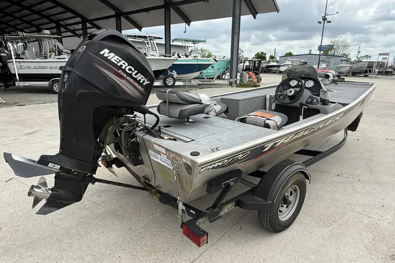 Slide: The Image of 2016 Tracker Pro 170 boat with Mercury outboard motor on trailer. - 6