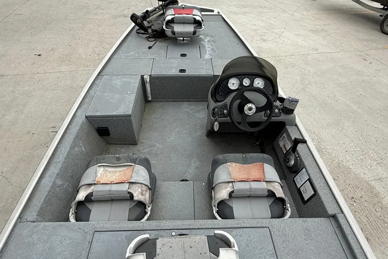 Slide: The Image of 2016 Tracker Pro 170 boat interior with steering console and seating. - 7