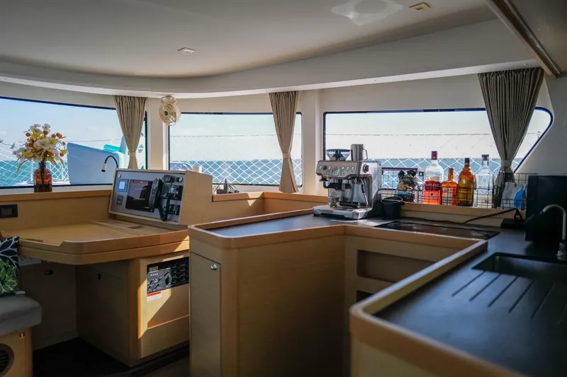 Slide: The Image of Interior of 2018 Lagoon 42 yacht with modern kitchen and ocean view. - 16