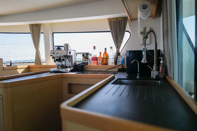 Slide: The Image of Interior of 2018 Lagoon 42 yacht kitchen with coffee machine and sink. - 17