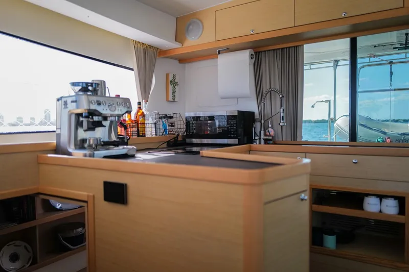 Slide: The Image of Modern kitchen interior of 2018 Lagoon 42 yacht with coffee maker and ocean view. - 21