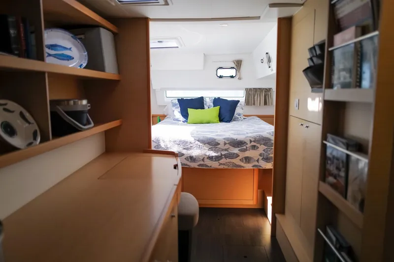 Slide: The Image of Interior of 2018 Lagoon 42 catamaran with cozy bedroom and wooden furnishings. - 32