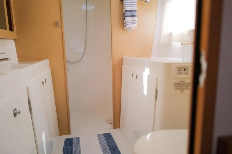 Slide: The Image of Interior of 2018 Lagoon 42 yacht bathroom with shower and striped towel. - 39