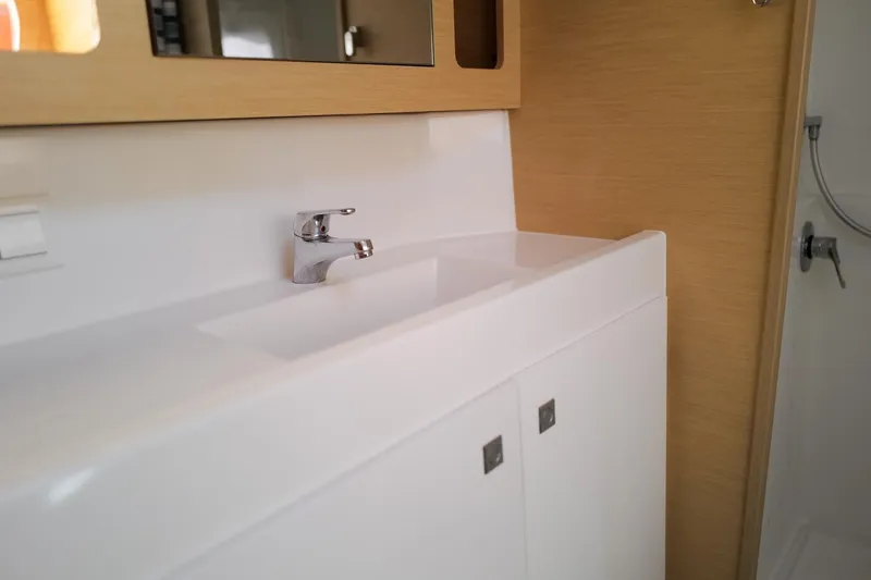 Slide: The Image of Modern bathroom sink in 2018 Lagoon 42 yacht, featuring sleek design and chrome faucet. - 40