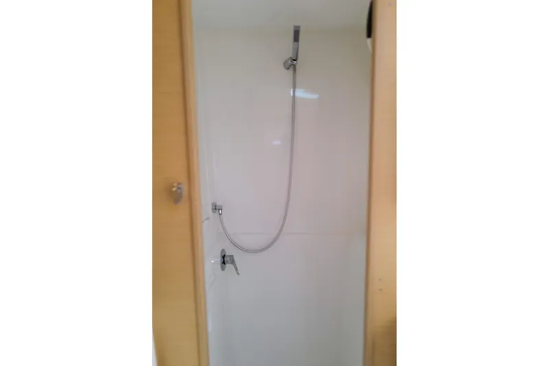 Slide: The Image of Shower area inside 2018 Lagoon 42 catamaran, featuring modern fixtures and sleek design. - 41