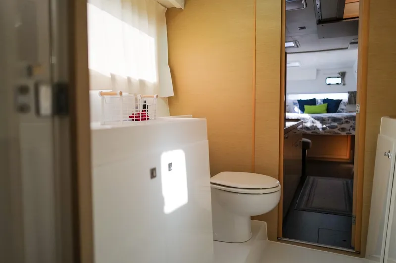 Slide: The Image of Interior of 2018 Lagoon 42 yacht showing bathroom and bedroom with modern design. - 42