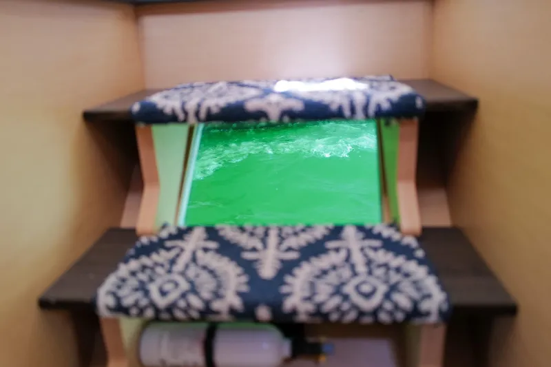 Slide: The Image of Interior view of Lagoon 42 yacht, 2018 model, featuring a glass floor panel. - 43