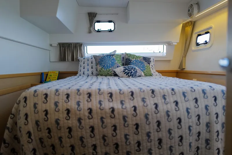 Slide: The Image of Cozy bedroom in 2018 Lagoon 42 yacht with seahorse-themed bedding and decorative pillows. - 47