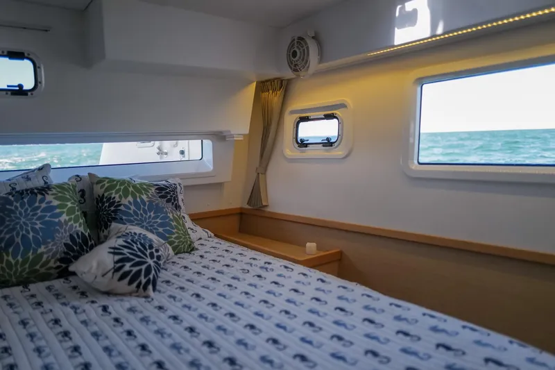 Slide: The Image of Cozy cabin interior of 2018 Lagoon 42 catamaran with ocean view through windows. - 48