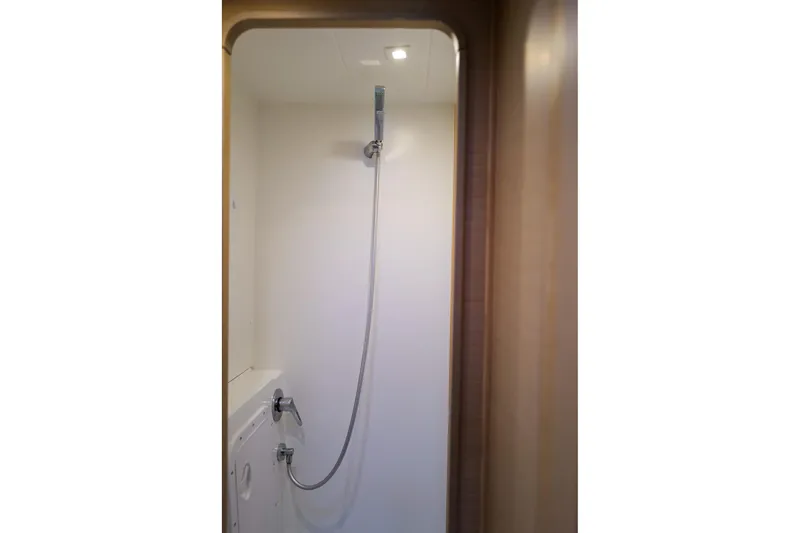 Slide: The Image of Shower area inside a 2018 Lagoon 42 yacht, featuring modern fixtures. - 51