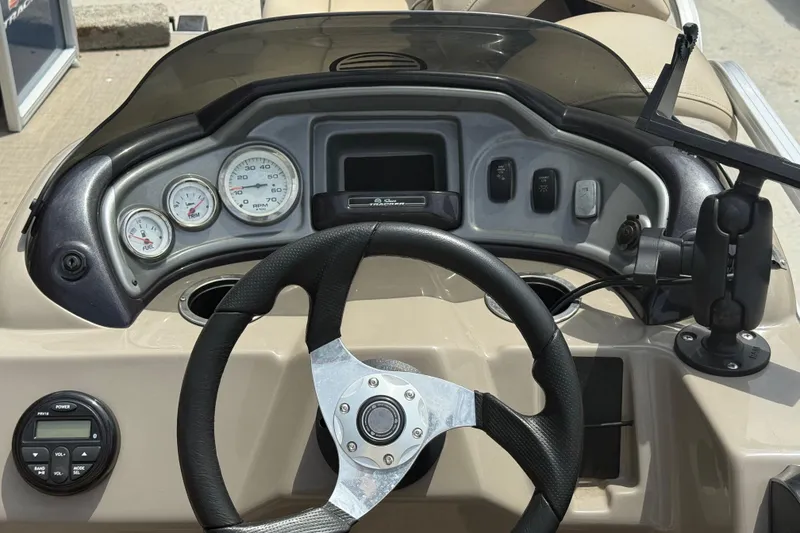 Slide: The Image of Steering console of 2021 Sun Tracker Party Barge 20 DLX with gauges and controls. - 9