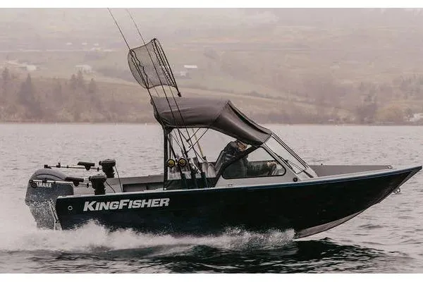 The Image of 2026 KingFisher 1625 Falcon boat cruising on a lake with fishing gear. - 1