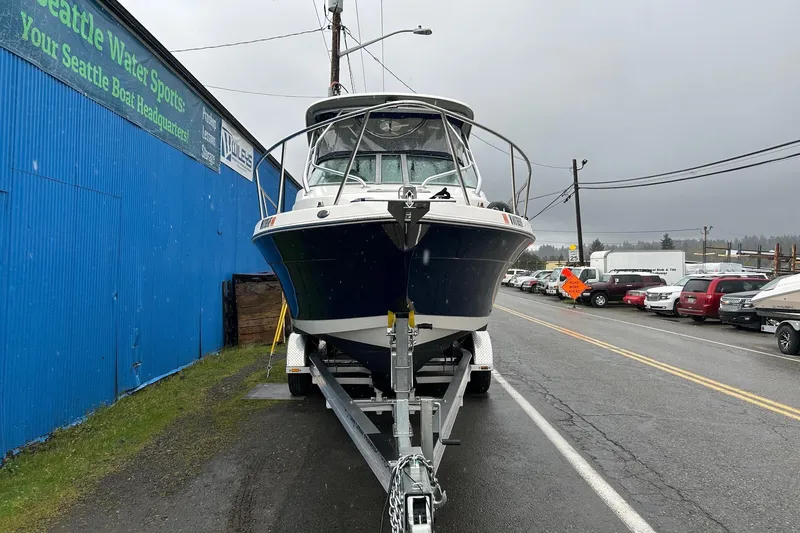 Slide: The Image of 2011 Robalo R265 Walkaround boat on trailer near Seattle Water Sports building. - 2