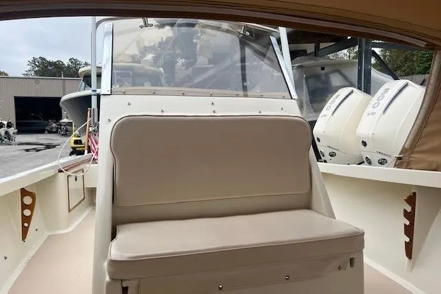 Slide: The Image of 1993 Padebco V-21 boat interior with seating and dual outboard motors. - 17