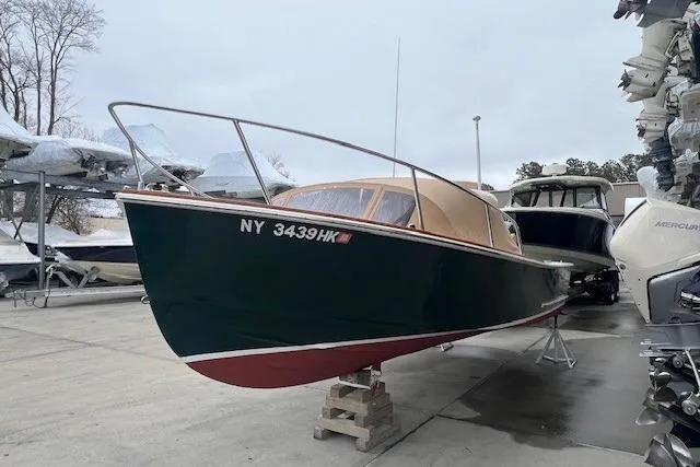 Slide: The Image of 1993 Padebco V-21 boat on dry dock, green hull, tan cabin, NY registration. - 3