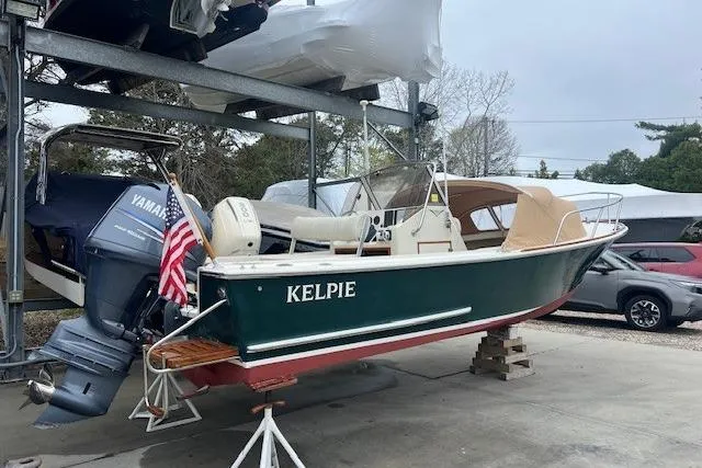 Slide: The Image of 1993 Padebco V-21 boat named "Kelpie" with Yamaha outboard motor on a stand. - 4