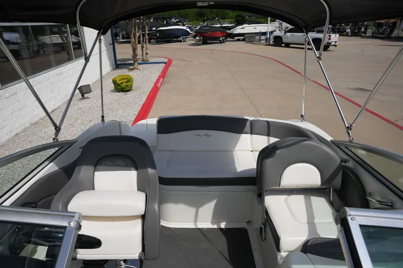 Slide: The Image of Interior of a 2011 Sea Ray 200 Sundeck boat with seating. - 13