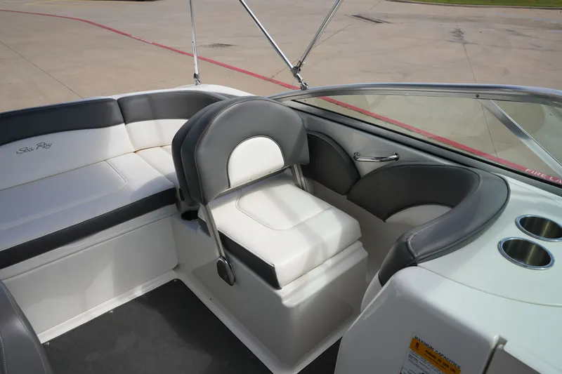 Slide: The Image of Interior of a 2011 Sea Ray 200 Sundeck boat with gray seating. - 14