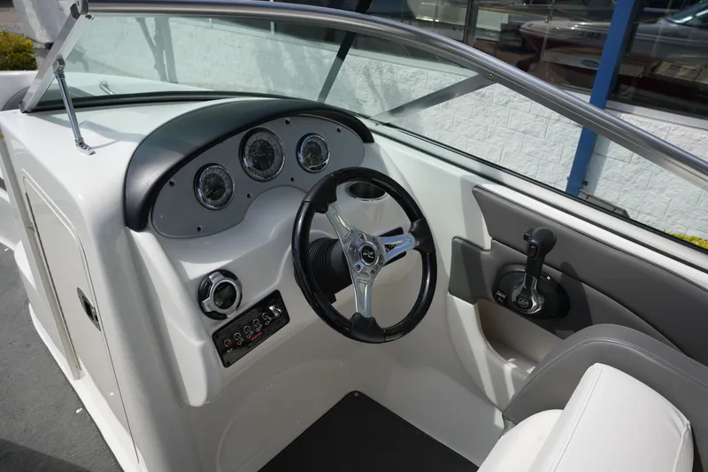 Slide: The Image of Interior view of 2011 Sea Ray 200 Sundeck helm. - 17