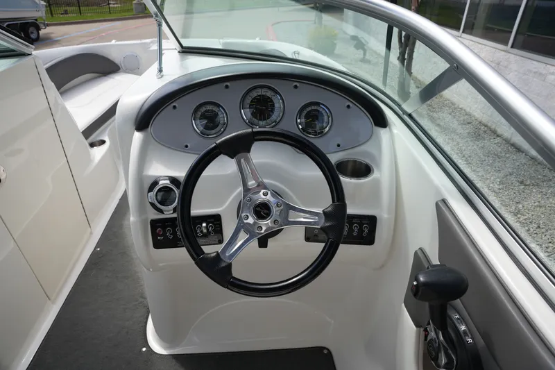 Slide: The Image of Steering console of a 2011 Sea Ray 200 Sundeck boat. - 19