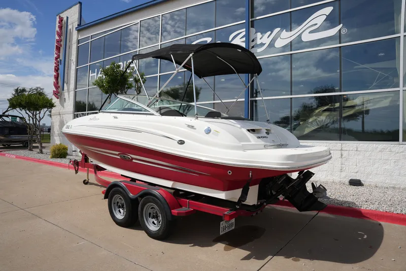 Slide: The Image of 2011 Sea Ray 200 Sundeck boat on trailer at MarineMax. - 2