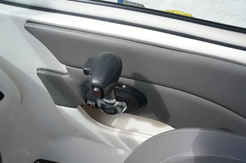 Slide: The Image of Close-up of throttle lever on a 2011 Sea Ray 200 Sundeck. - 23