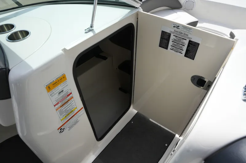 Slide: The Image of Interior of 2011 Sea Ray 200 Sundeck with storage compartment. - 26