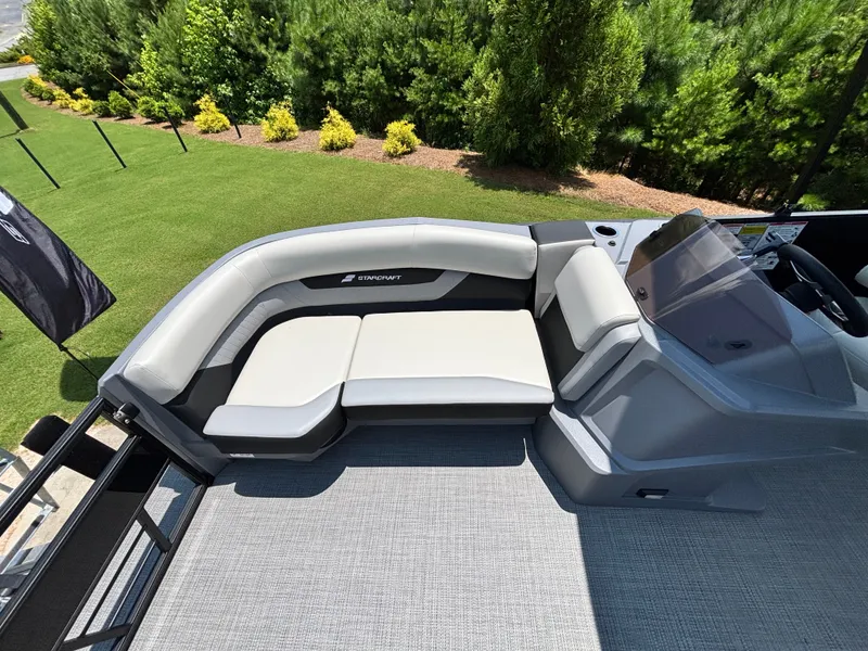 Slide: The Image of The image shows the deck of a 2026 Starcraft VX 22 R DH with sleek seating. - 7