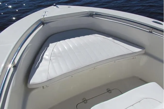 Slide: The Image of 2026 Bulls Bay 200 Center Console boat with powerful outboard motor in a sunny marina. - 3
