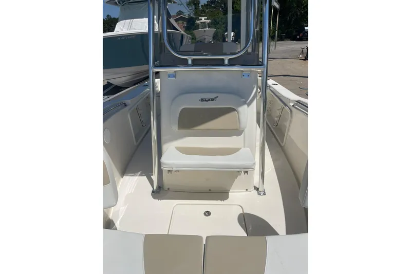 Slide: The Image of 2026 Bulls Bay 200 Center Console boat interior with seating and console view. - 9