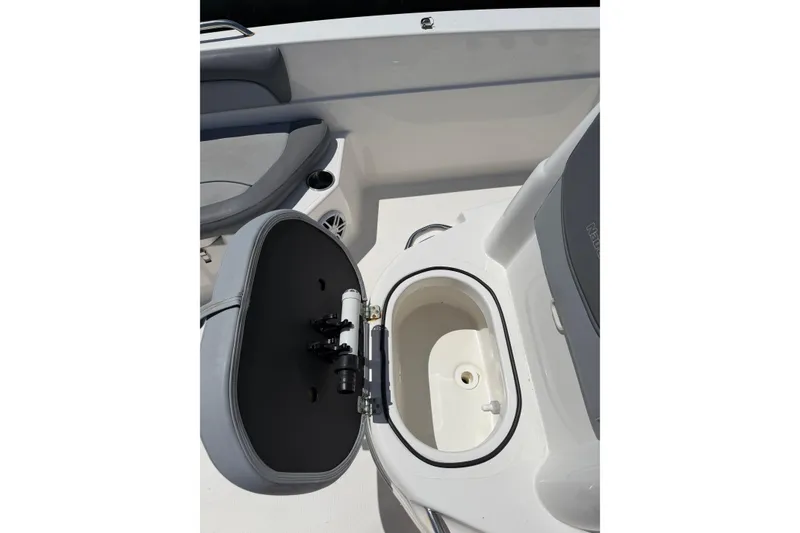 Slide: The Image of 2023 NauticStar 211 Hybrid boat interior with open storage compartment. - 7