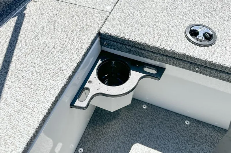Slide: The Image of 2026 Lund 1700 Explorer Sport boat interior with cup holder and carpeted flooring. - 23