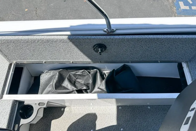 Slide: The Image of Storage compartment in 2026 Lund 1700 Explorer Sport boat, featuring a sleek interior design. - 21