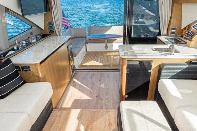 Slide: The Image of Luxurious interior of 2017 Sea Ray 460 Sundancer yacht with high quality  seating and ocean view. - 11